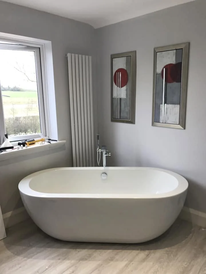 Freestanding bath and column radiator fitted by RC Renovation Ltd