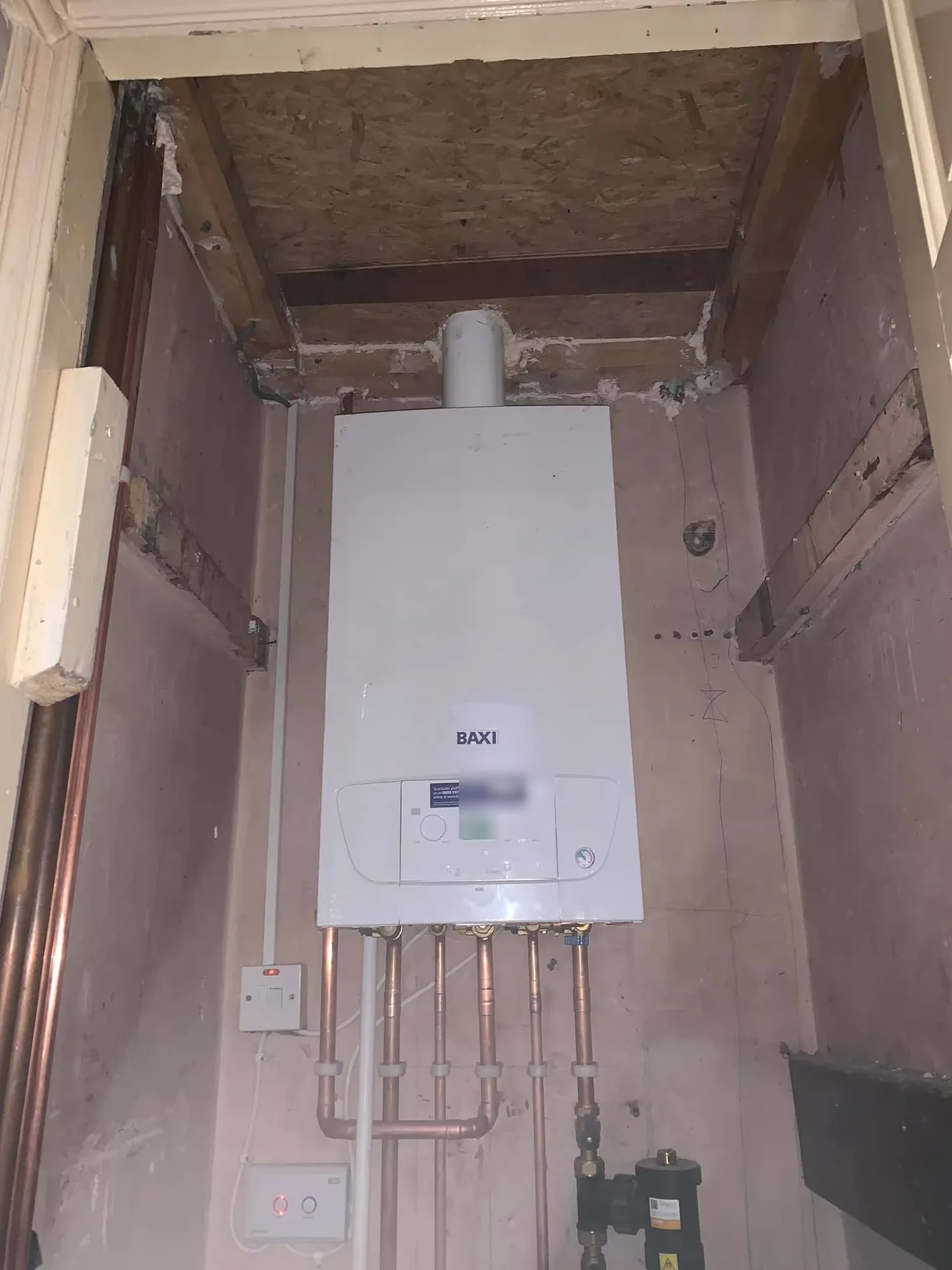 Baxi boiler and flue installed in a cupboard during a boiler replacement