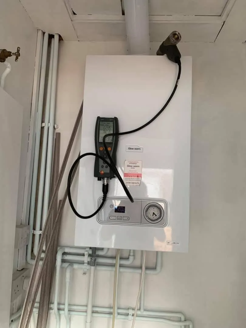 Flue gas analyser testing a Glow-worm boiler during an annual service